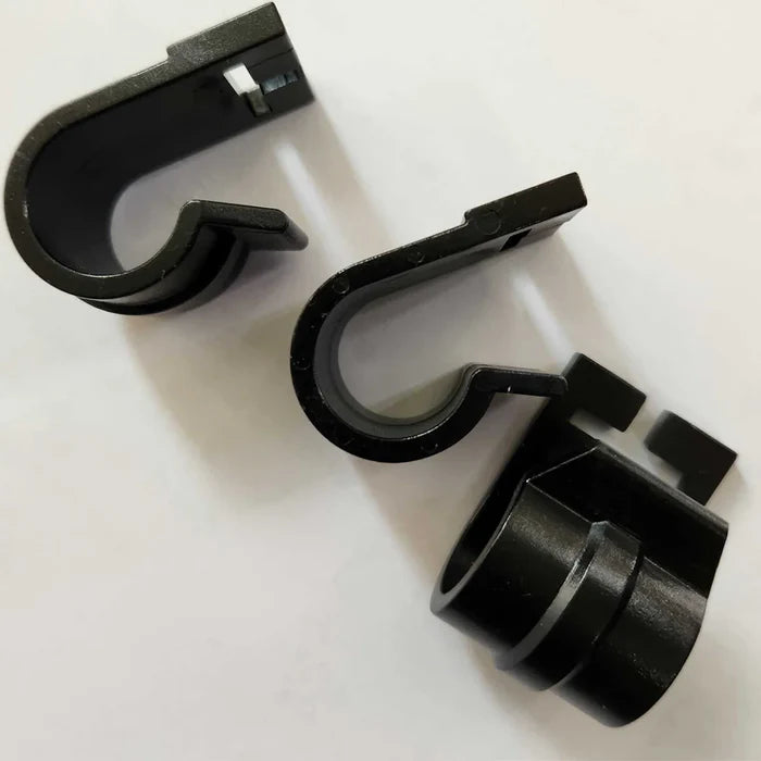 Three black plastic “The V - Replacement C Clips” by The V, each featuring a hook-shaped design and rectangular notch, displayed on a white background—perfect as V Nets replacement clips for cricket training nets.