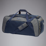 The Canterbury Classic Holdall Bag by Canterbury is a large, rectangular navy waterproof gym bag with padded handles, an adjustable shoulder strap, side pockets, zip closure, and the Canterbury logo on the front and side.
