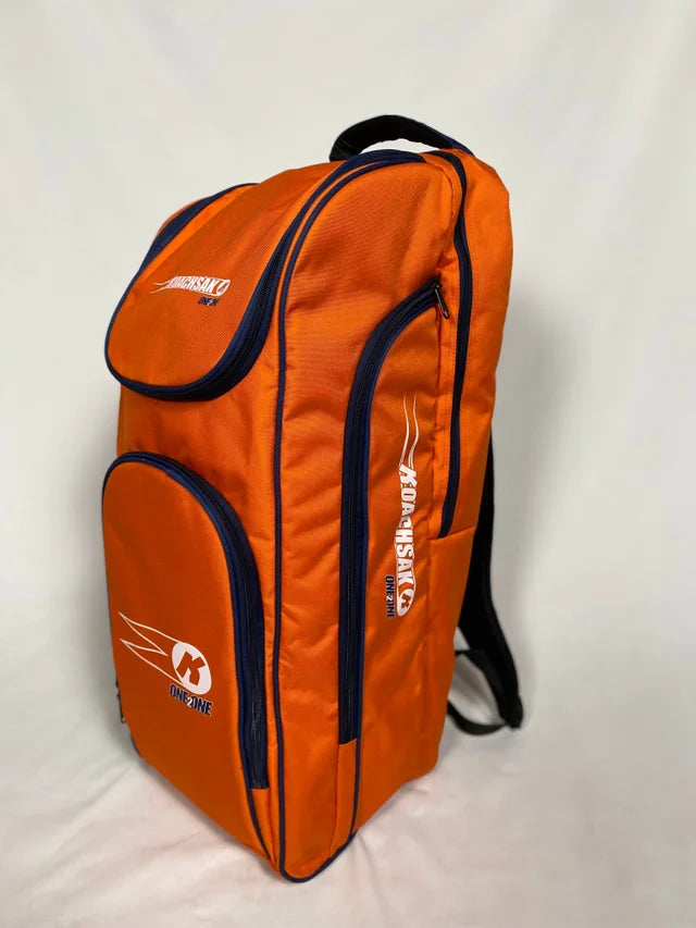 The KoachSak One2One by Katchet in orange/black stands upright against a white background, featuring black zippers, multiple compartments, sturdy shoulder straps—ideal for one to one coaching sessions.