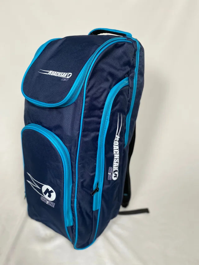 The Katchet KoachSak One2One is a navy/sky cricket equipment bag with multiple compartments and the Katchet logo, ideal for one-to-one coaching. The bag stands upright on a plain white background.
