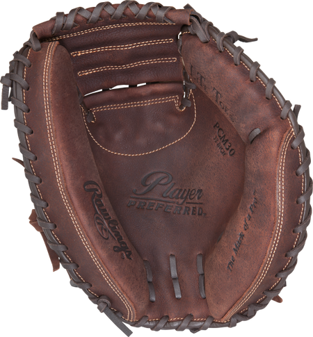A close-up of the Rawlings Player Preferred - Catchers Mitt by Rawlings, featuring brown full-grain leather with visible stitching, laces, and the Player Preferred logo stamped inside.