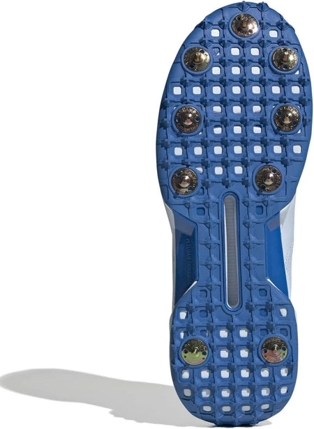 The image features the Adidas 22YDS White/Red/Royal Cricket Spikes 2026 with a blue sole, seven metallic spikes, and patterned tread for enhanced grip on grass.