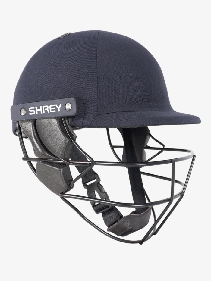 A Shrey Armor 2.0 Mild Steel Helmet in navy, featuring an adjustable chin strap, side padding, and mild steel face guard. The Shrey brand name is visible on the side, with the helmet displayed against a plain white background.