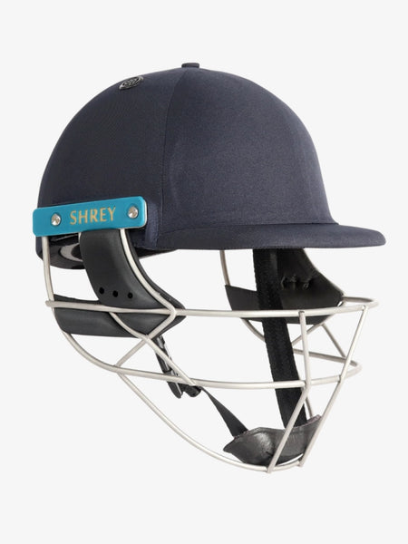 A Shrey Masterclass Air 2.0 Helmet by Shrey in navy, featuring a metal faceguard and side panel, is displayed on a white background.
