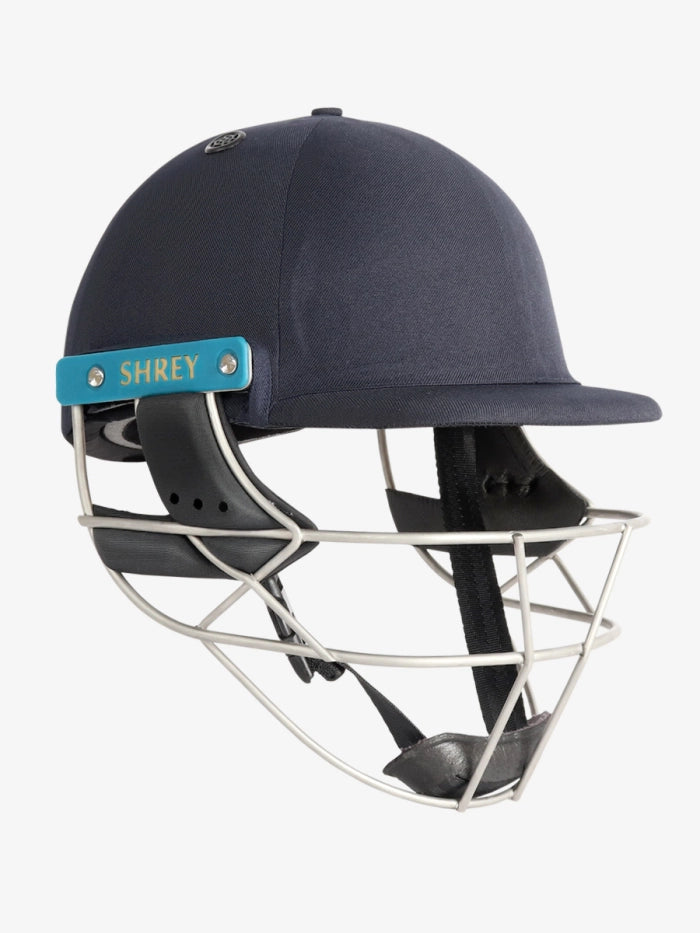 A Shrey Masterclass Air 2.0 Helmet by Shrey in navy, featuring a metal faceguard and side panel, is displayed on a white background.