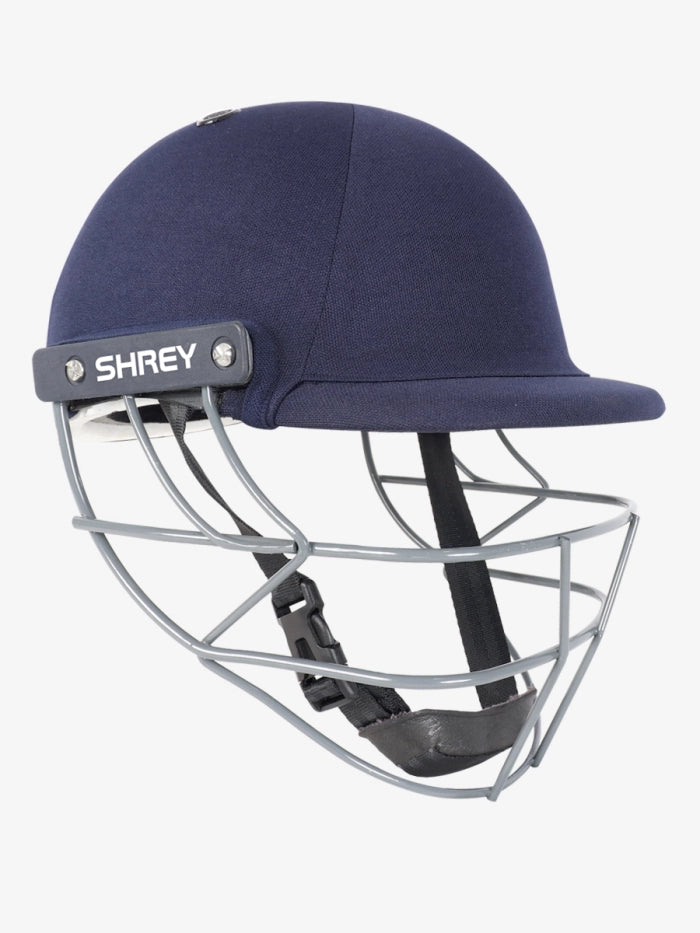 The Shrey Performance 2.0 Mild Steel Cricket Helmet Junior in navy, featuring a mild steel faceguard, black chin strap, and Shrey branding on the side, is displayed against a plain white background.