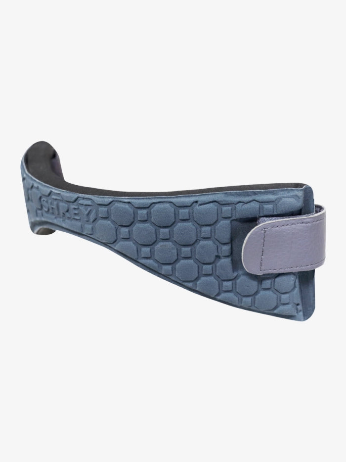 A close-up of the Shrey Pro Neck Protector (Grey) by Shrey, featuring a textured blue-gray padded strap with a hexagonal pattern and an adjustable gray leather tab, designed for impact absorption, shown against a white background.