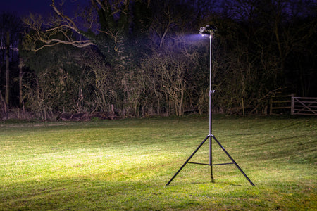 The Ritelite Sports Lite Portable Floodlights provide bright, portable lighting on a tall tripod stand—perfect for illuminating grassy areas at night for sports training or outdoor activities.