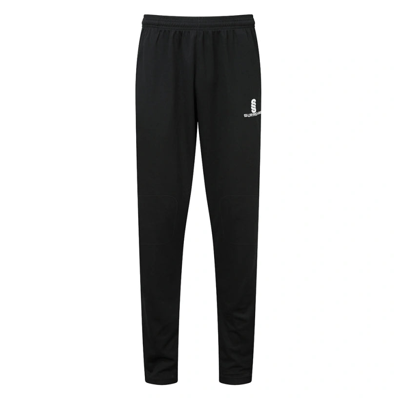 The Surridge Blade Coloured Playing Trouser in black features an elastic waistband, reinforced knees, and a small white S logo with SUBLIME text on the upper left thigh, shown against a plain white background.