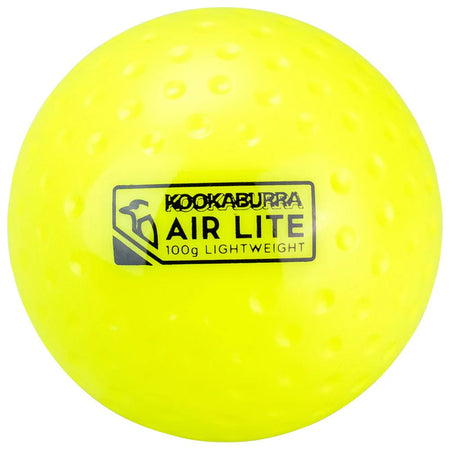 The Kookaburra Air Lite Dimple Hockey Ball in yellow features a dimpled surface, black logo and text, weighs 100g, and is an ideal lightweight training aid from the trusted Kookaburra range.