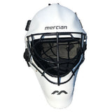 The Mercian Genesis Hockey Helmet features a white fibreglass shell, cats-eye grill for superior protection, inner cushioning, and “mercian” branding on the front.
