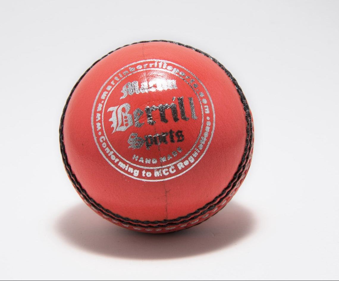 An orange leather cricket ball with black stitching, hand stitched for junior league cricket, featuring "Martin Berrill Sports" silver branding on the surface, is shown against a plain white background. Product: MBS Supreme Crown Cricket Ball (Orange).