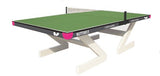 The Butterfly Ultimate Table Tennis Table by Butterfly is shown in green with a net, featuring white angled legs and pink corner accents against a white background.