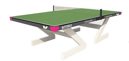 The Butterfly Ultimate Table Tennis Table by Butterfly is shown in green with a net, featuring white angled legs and pink corner accents against a white background.