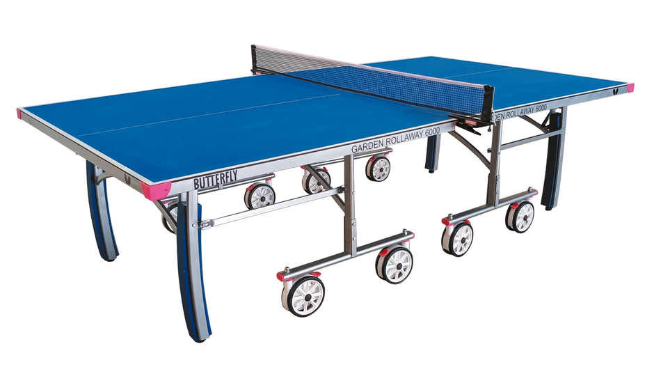 The Butterfly Garden Rollaway 6000 6mm Outdoor Table Tennis Table features a blue melamine top, net, foldable legs, and large wheels for easy transport.