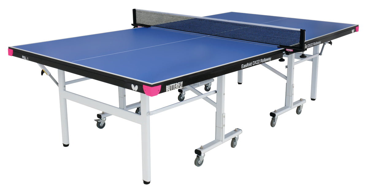The Butterfly Easifold Deluxe 22 Rollaway Table Tennis Table features a 22mm match top, white frame, wheels for mobility, and a black net. This Butterfly table arrives set up and ready for play.