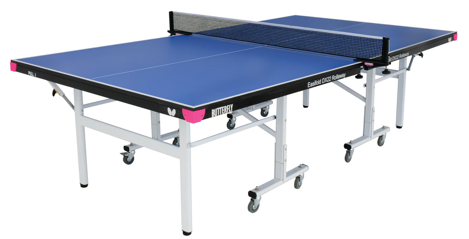 The Butterfly Easifold Deluxe 22 Rollaway Table Tennis Table features a 22mm match top, white frame, wheels for mobility, and a black net. This Butterfly table arrives set up and ready for play.