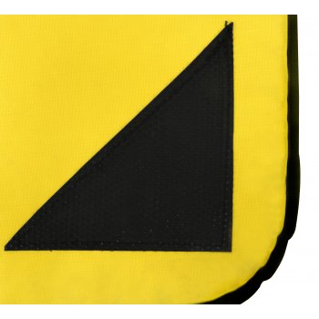A close-up of the Sure Shot Aerobic Non Slip 10mm mat in yellow, featuring a black triangular patch sewn on one corner and part of the black border along the edge.
