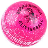 A bright pink Kookaburra Glitter ball cricket training ball, labeled “Kookaburra Glitter ball” in bold black letters, and featuring the Kookaburra brand logo above the text.