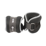 Fitness Mad Wrist/Ankle Weights by Fitness Mad feature black and gray neoprene, Velcro straps, and metal loops—ideal for fitness and strength training. Branded with the Fitness Mad logo, they’re perfect for aerobic workouts.