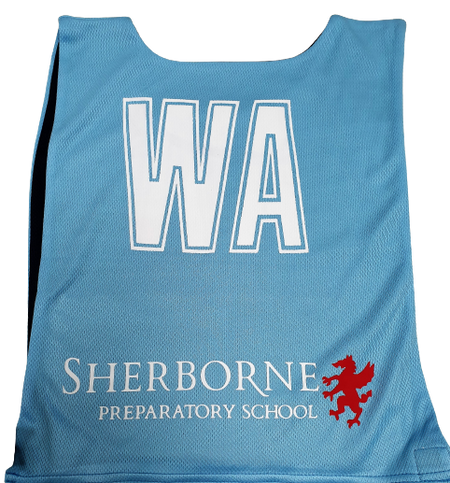 A light blue Personalised Gilbert Netball Bib (Single Bib) by Gilbert, displaying large white WA letters, "Sherborne Preparatory School" text, and a red griffin logo beneath.