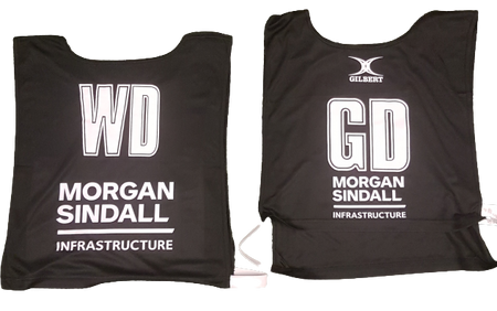 Two black Personalised Gilbert Netball Bibs (Single Bibs) by Gilbert: one with "WD Morgan Sindall Infrastructure," the other "GD," both with the Gilbert logo on top—high-quality custom bibs for your team.