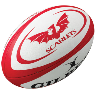 The Gilbert Scarlets Replica Rugby Ball by Gilbert features the Scarlets team logo with a red dragon—an ideal choice for any Guinness Pro 14 rugby fan.
