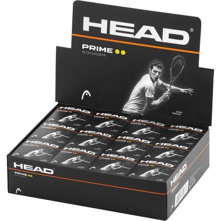 The Head Prime Squash Balls - Double Yellow Dot - Box of 12 is ideal for advanced players and pro competitions, featuring packaging with a black and white image of a male squash player and twelve individual balls inside.