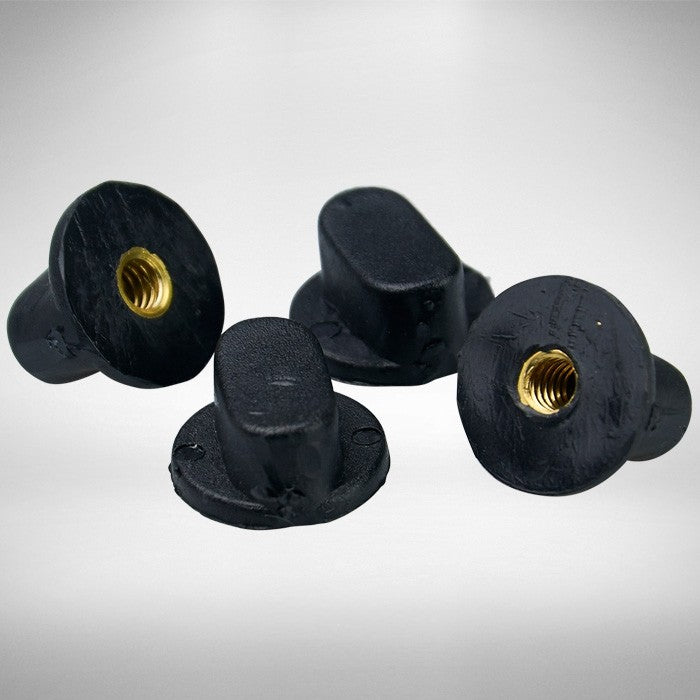 Four Kookaburra Helmet Screws in black rubber with threaded brass inserts are displayed on a light gray surface. Shaped for hand tightening, these Kookaburra brand screws feature smooth, rounded tops—ideal as replacement helmet screws.