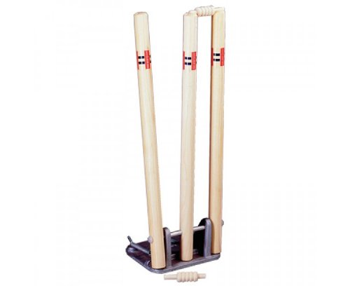 Three wooden stumps with two bails on top, set in a metal base and one bail on the ground—ideal cricket training equipment like the Gray Nicolls Senior Spring Return Stumps by Gray Nicolls.