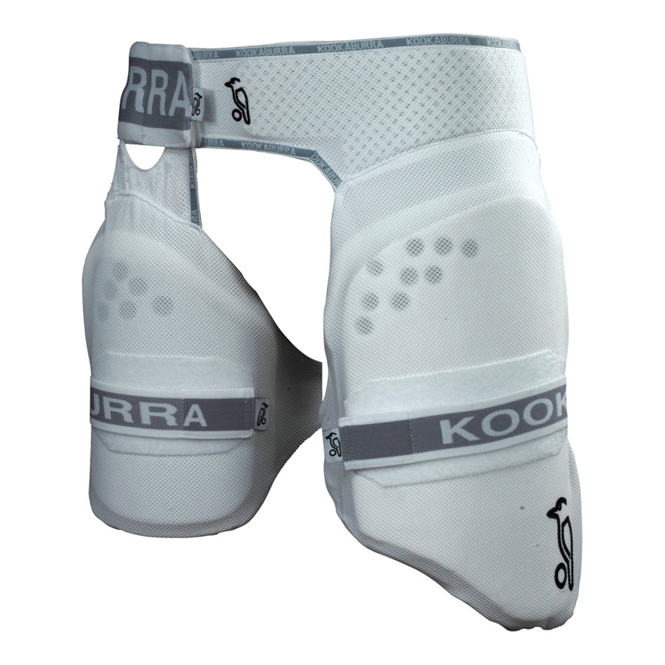The Kookaburra Pro Guard Players Thigh Pad features adjustable straps, gray branding, and test match level impact protection, with ventilation holes and mesh panels for breathability and comfort during play.