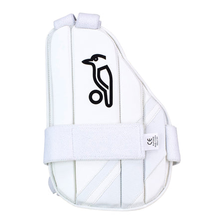 The Kookaburra Pro Inner Thigh Guard is a white thigh pad from Kookaburra, featuring a black bird logo, ball graphic, velcro straps, padded protection, and a multi flex design for enhanced impact safety.