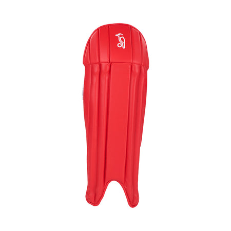 The Kookaburra 4.0 T20 Wicket Keeping Pad by Kookaburra is a bright red, lightweight adult shin guard with vertical padding and a small white logo near the top, designed for maximum impact protection, shown on a plain white background.