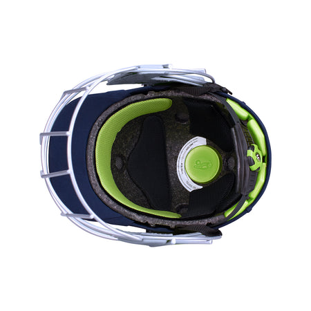 Top view of the Kookaburra Pro 1200 Junior Helmet by Kookaburra, featuring a steel faceguard, black and green padding, visible inner cushioning, and a round back adjustment dial.
