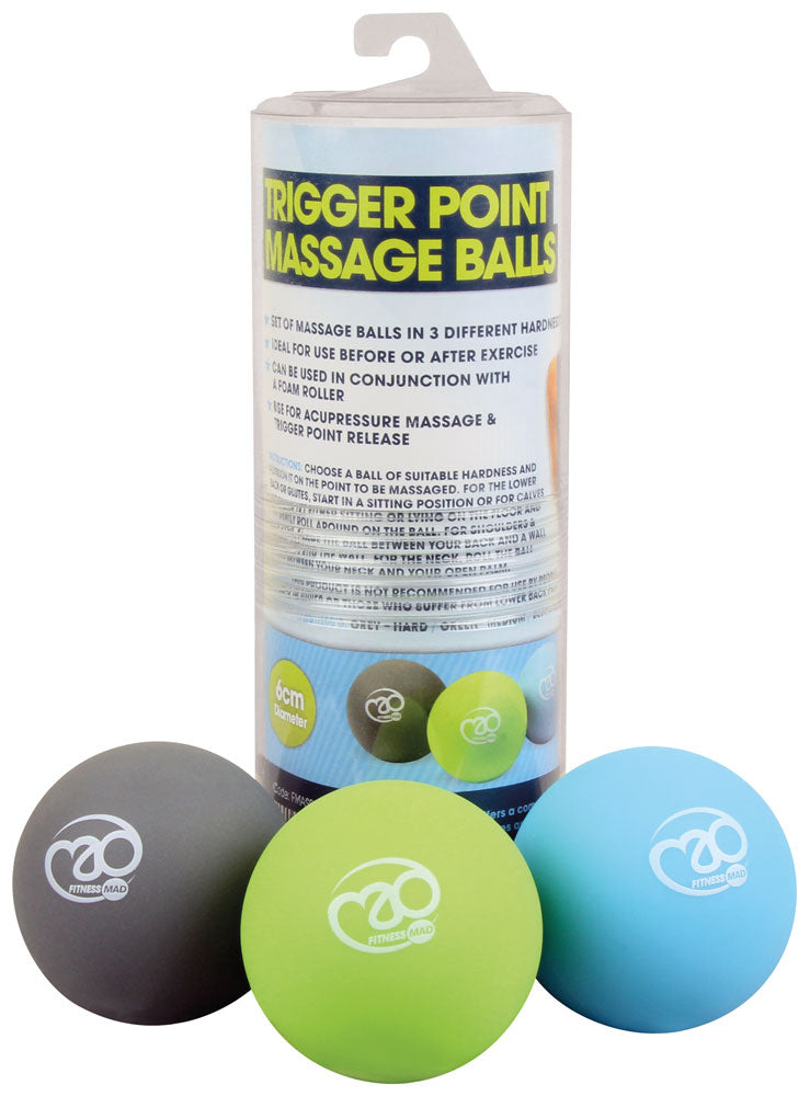 The Fitness Mad Trigger Point Massage Ball Set features three massage balls in gray, green, and blue, displayed before clear cylindrical packaging with the Fitness Mad logo—ideal for targeted sports massage and muscle tension relief.