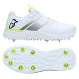 Two views of the Kookaburra KC Players Spike by Kookaburra: a white sports shoe with lime green accents, penguin logo, and metal cricket spikes. The top view shows its lightweight, breathable insole; the bottom view displays spike arrangement.
