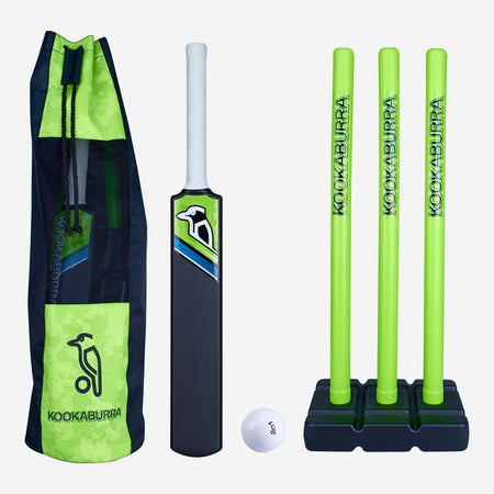 The Kookaburra Blast Cricket Set for beginners includes an impact-resistant bat with a white handle, a white ball, three green stumps on a black base, and a green and black bag—all featuring the Kookaburra brand.