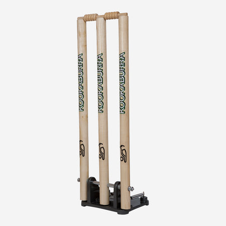 The Kookaburra Spring Return Stumps by Kookaburra feature three upright wooden stumps on a black base, perfect for cricket training and practice sessions.