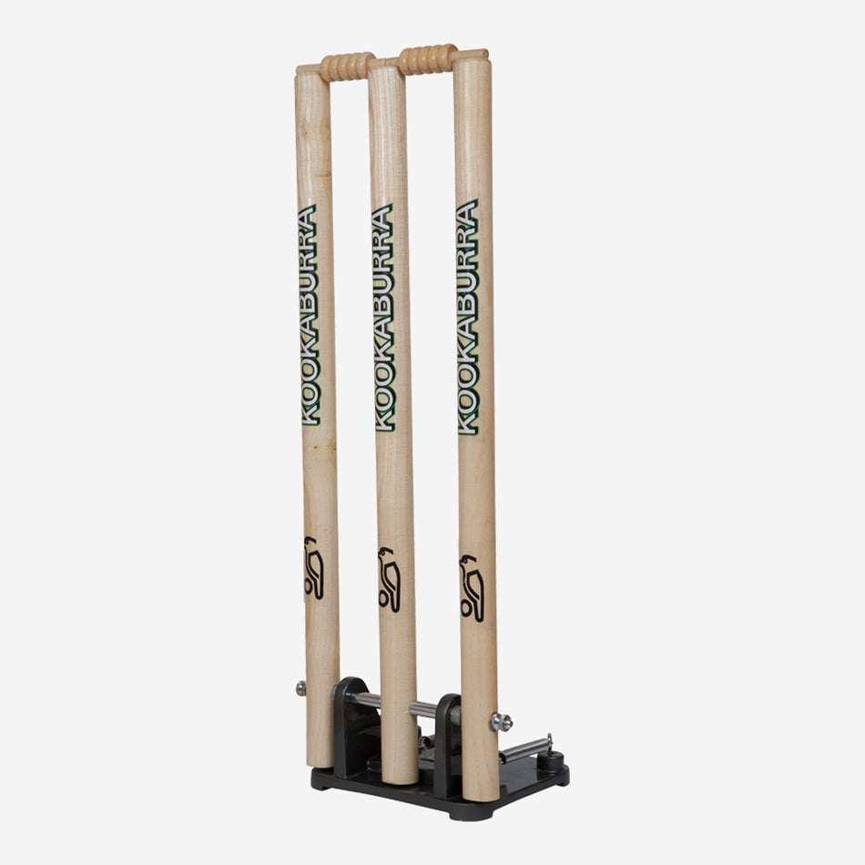 The Kookaburra Spring Return Stumps by Kookaburra feature three upright wooden stumps on a black base, perfect for cricket training and practice sessions.