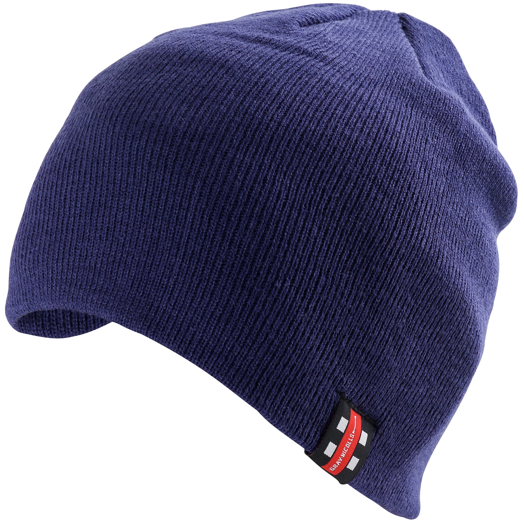 The Gray Nicolls Beanie Hat by Gray Nicolls is a navy double-layer knit beanie with a small red, black, and white rectangular tag on the brim. It has a relaxed shape for added comfort and warmth.