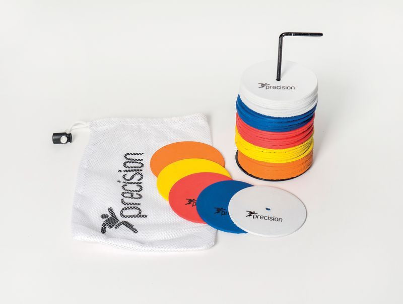 A set of Precision Training Precision Small Round Rubber Marker Discs (Set of 50) in assorted colors sits stacked on a metal stand with an allen key, beside a white carry bag labeled "Precision," all on a plain white background.