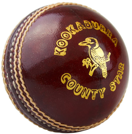 The Kookaburra County Star Cricket Ball features dark red leather, stitched seams, gold text, and a kookaburra logo. Durable and ideal for matches or training, this official Kookaburra product is perfect for serious cricketers.