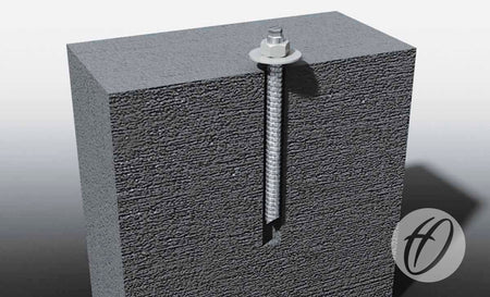 A Harrod Sport Chem Bolt Anchor with washer and nut is vertically installed in a gray concrete block, partially embedded for secure ground fixing, with the Harrod Sport logo displayed in the lower right corner.