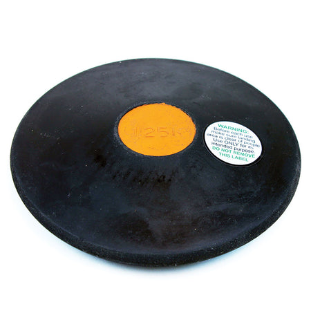 The Mastersport Rubber Training Discus features a black rubber body with a yellow center labeled "1.25k" and a white warning label. Durable and ideal for track and field training, it is shown against a white background.