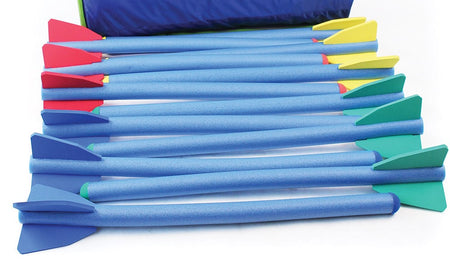 Twelve Mastersport Foam Javelins with blue bodies and colorful fins are displayed side by side on a white surface. A blue carry bag, included for easy transport, is partially visible at the top.