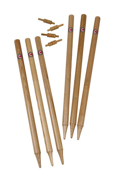 Six Hunts County Club Stumps 28" and four wooden bails, each with pointed ends and small round labels near the top, are neatly arranged on a white background.