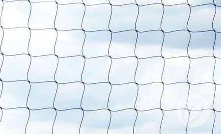 A close-up of the Harrod Sport Replacement Crowd Protection Net (40M x 5M) shows its black mesh grid pattern contrasted against a bright, cloudy sky, with soft light passing through the netting.