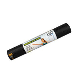 A rolled-up black Fitness Mad Yoga-Mad Warrior II Mat 4mm with a woman in a yoga pose on the packaging; its textured, phthalate-free surface offers improved grip, and product details are listed on the label.
