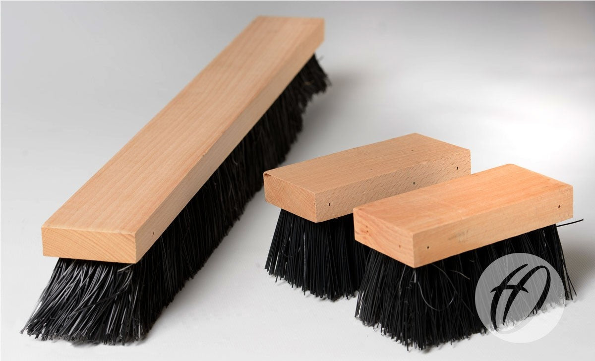 Three Harrod Sport Spare Brush Kit - Multi Boot Wiper brushes with durable polypropylene bristles are displayed on a white surface. One is long and rectangular, two are shorter, and a circular logo appears in the bottom right corner.