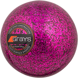 The Grays Glitter Xtra Hockey Ball is a bright pink ball with glitter, featuring the Grays logo—ideal for playing under floodlights.